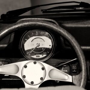 A close up of the dashboard and speedometer in a car